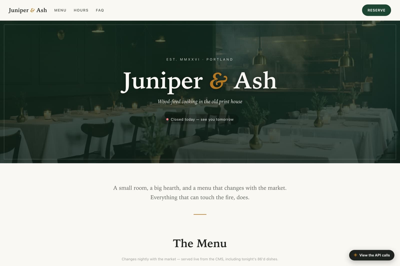 The Juniper & Ash demo restaurant site — a photographic hero with the restaurant name, an open/closed status, and the start of the menu.